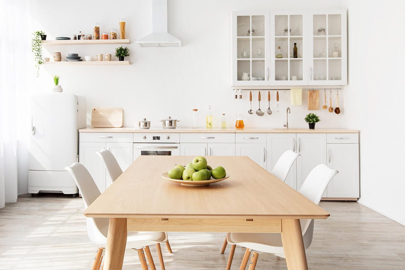 Clean kitchen setting with apples on table