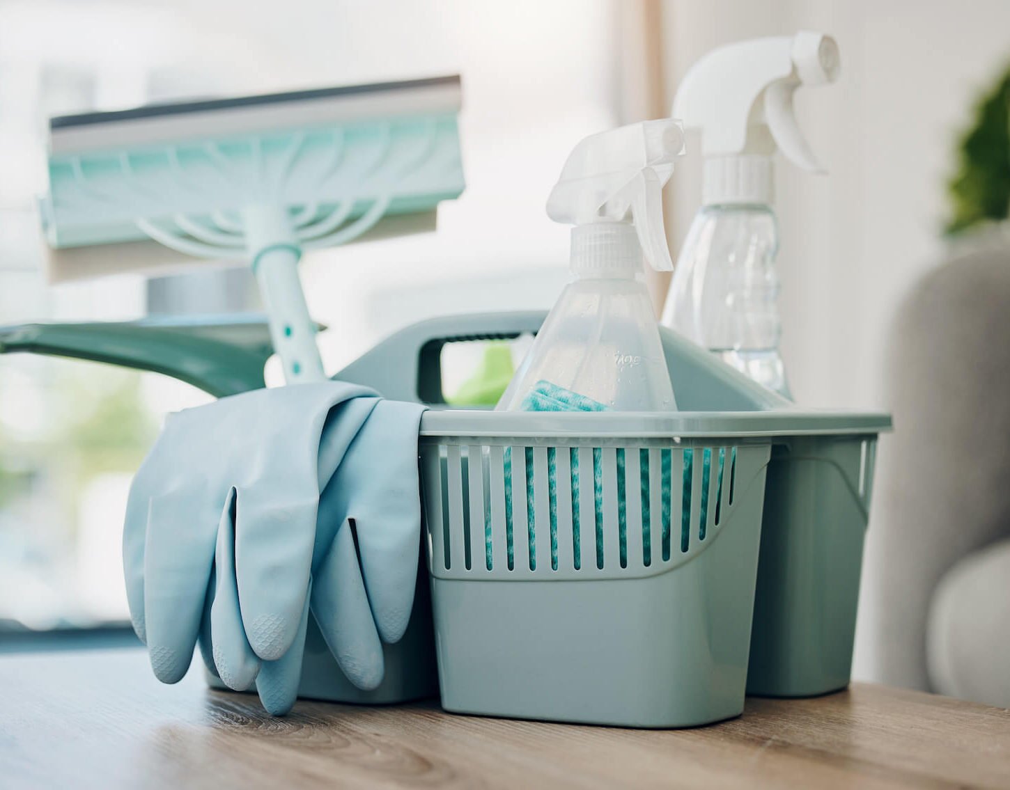 Basket of cleaning supplies and gloves