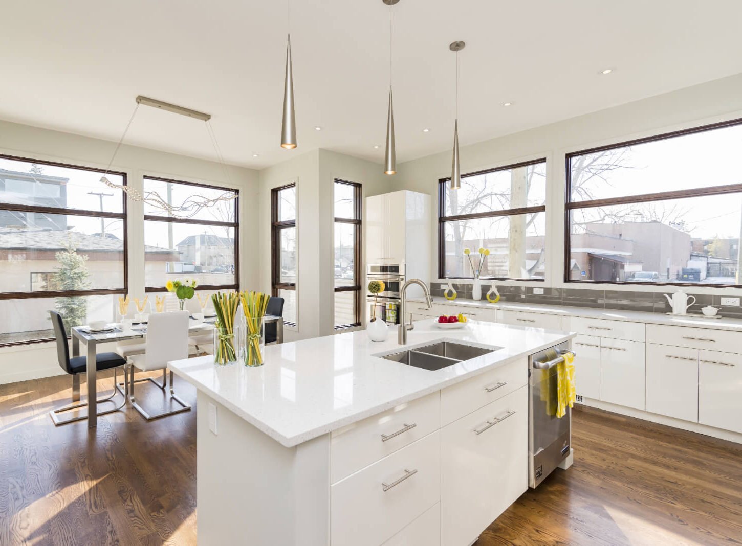 Modern white kitchen with multiple windows