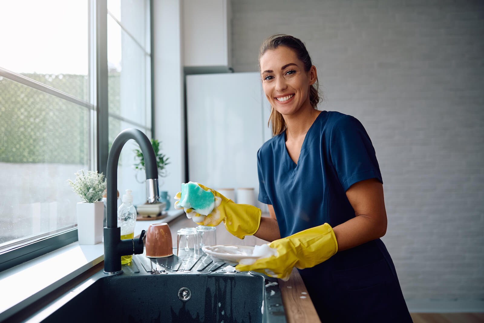 professional cleaning service washing dishes