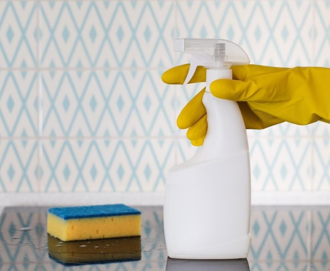 Housekeeper Holding Cleaning Supplies